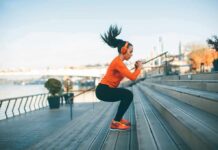 Scientists Spot Muscle ‘On’ Switch – No Pills Woman exercising on outdoor steps by a riverside