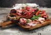 Daily Deli Meats, Dementia Warning Charcuterie board with assorted cured meats and herbs