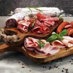 Daily Deli Meats, Dementia Warning Charcuterie board with assorted cured meats and herbs