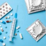 Hormone Therapy Myth – Heart Risk Rises Contraceptives and medications on blue background