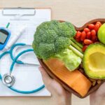 DNA Clock Slows With These Foods Heart-shaped bowl of healthy foods with medical tools