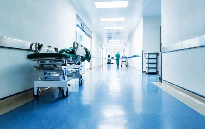 shutterstock_1723539229 Hospital hallway with empty gurney