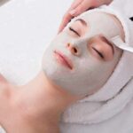 The everyday habits that damage your skin barrier person receiving a facial mask at a spa
