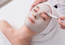 person receiving a facial mask at a spa