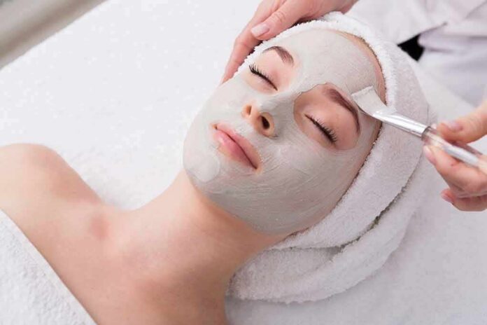 person receiving a facial mask at a spa