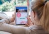 Woman using a tablet to view the Airbnb app page